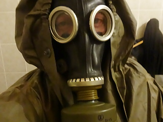 PervLinda Gumlin with gas mask and NVA Coat