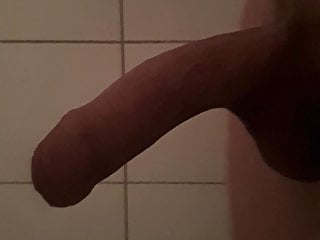 Fat curved cock grows in the shower