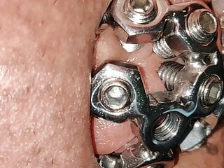 close up of the set screw in my chastity cage