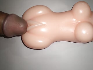 Sex doll dick rubbing.