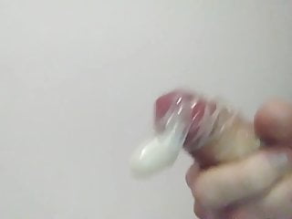 Blowing hot jizz into a condom...