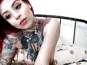 gorgeous tattooed redhead proudly shows pierced tits