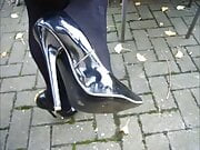 Strolling down the street in my black patent leather high-heeled stilettos