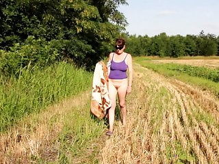 EB nude posing in the field