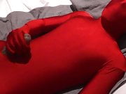 Red Zentai Twink Finishes Off Handjob