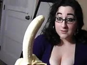 Big boob brunette sucking banana