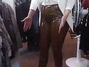 Wife in brown Latex Pants in her boutique