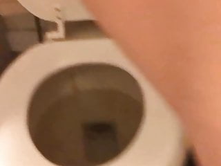 European girl in high heels pissing on the toilet