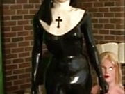 Rubber Nun Poses With Female Silicone Mask