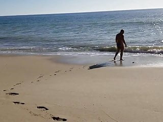 Beach walk in tiny bikini...