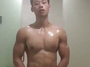 The super hot muscle asian guy take a shower after workout