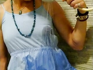 Transgirl wetlook in light-blue summer dress in the shower.