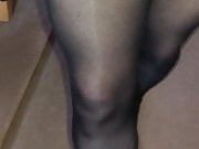 Trannie Walking in opaques stockings nylons in high  heels 