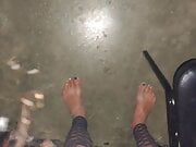 Sarah barefoot at theater starting at the gloryhole