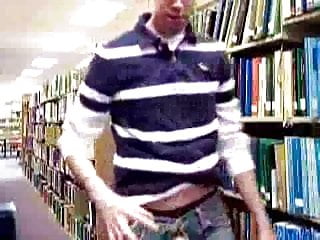 Guy stroking in university library...