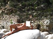 Naked boy on the beach, cute naturist,