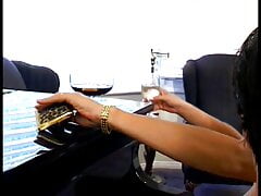 Big busty girl spreading her wet pussy on the piano to get licked