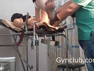 girl in a black mask. exam in gyno chair