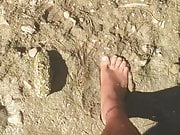 Jons Barefoot in river mud 