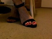 Red toes showing off in heels