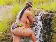 Topless South African with huge booty showers in waterfall
