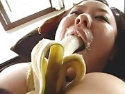 Big tits asian sucking a banana