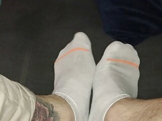 Old worn white stockings male feet...