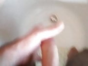 Fantastic cumshot in the shower tub