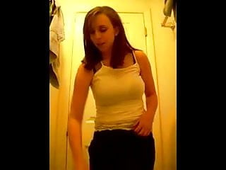 Cute girl records herself trying on...