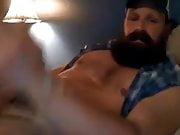 Hot muscular bearded guy shooting a big load