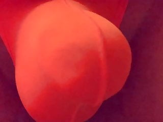 Playing in a orange thong