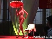 Hot busty stripper posing with umbrella