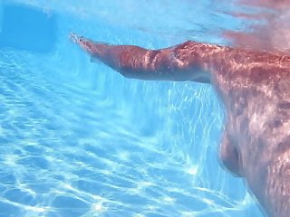 mature underwater in swimming pool 