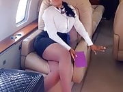 a big ass sexy flight attendant on a plane