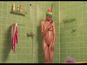 Hot woman make shower naked in rubber swimcap