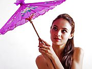 Fedra toying her pussy with a purple parasol