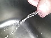 Slow Motion Pissing in Sink