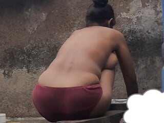 Desi Indian village bathroom in open courtyard wearing red tights bathing