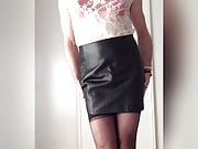 Sexy in leather skirt, stockings and satin lingerie