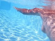 mature underwater in swimming pool 