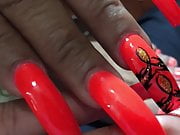 Latina with sexy long orange(different design) nails 