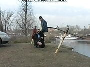 Redhead student sucks on the banks of the river for all to s